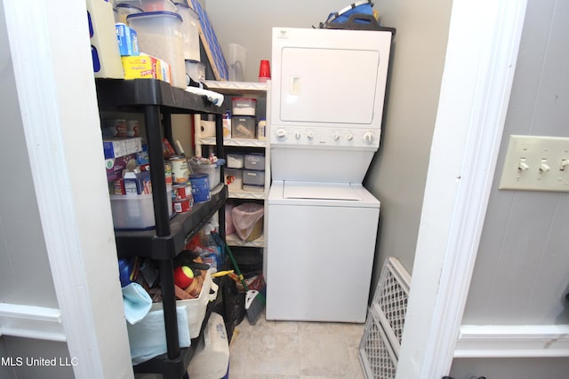2174 County Road 53, Water Valley, MS 38965 - laundry room with light tile patterned flooring and stacked washer and dryer