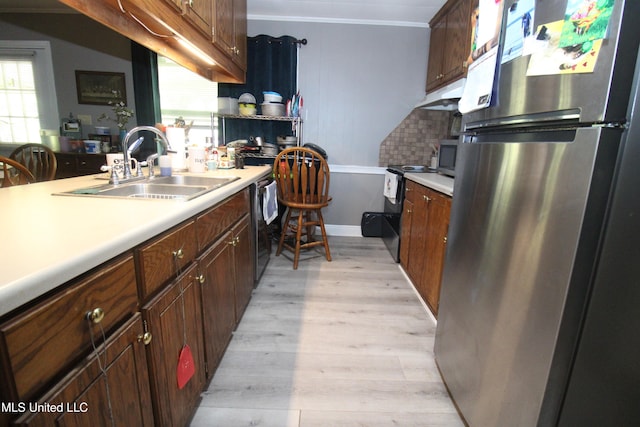 2174 County Road 53, Water Valley, MS 38965 - kitchen featuring black dishwasher, sink, crown molding, light wood-type flooring, and stainless steel refrigerator