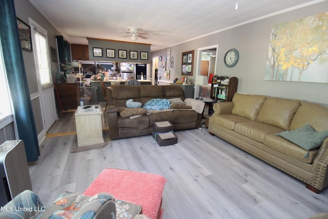 2174 County Road 53, Water Valley, MS 38965 - living room with light hardwood / wood-style flooring, ornamental molding, and ceiling fan