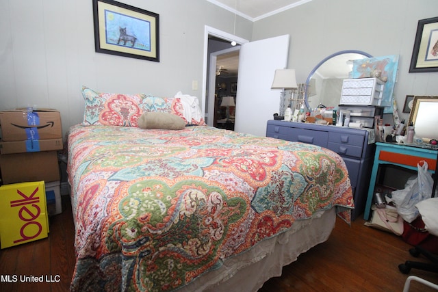 2174 County Road 53, Water Valley, MS 38965 - bedroom with dark wood-type flooring and crown molding
