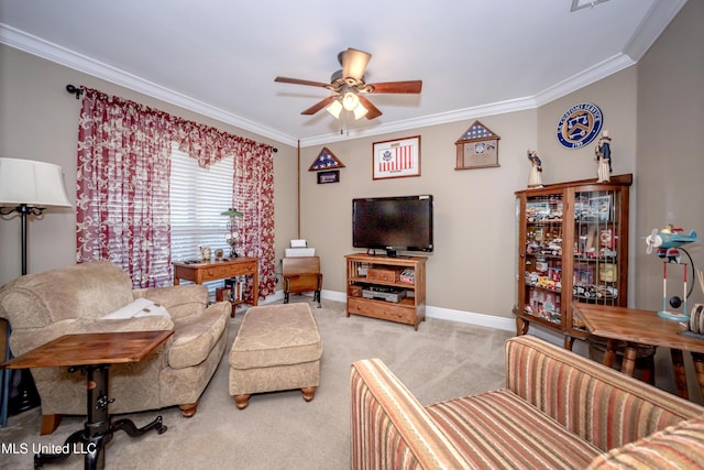 carpeted living room featuring crown molding, baseboards, and a ceiling fan