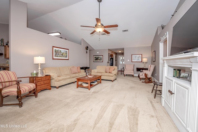 living area featuring visible vents, ceiling fan, light colored carpet, and vaulted ceiling