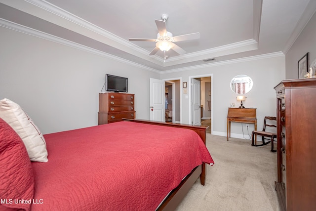 bedroom with a ceiling fan, ornamental molding, visible vents, light carpet, and a raised ceiling