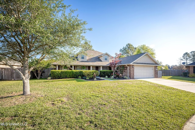 traditional-style home with a front yard, a garage, fence, concrete driveway, and brick siding