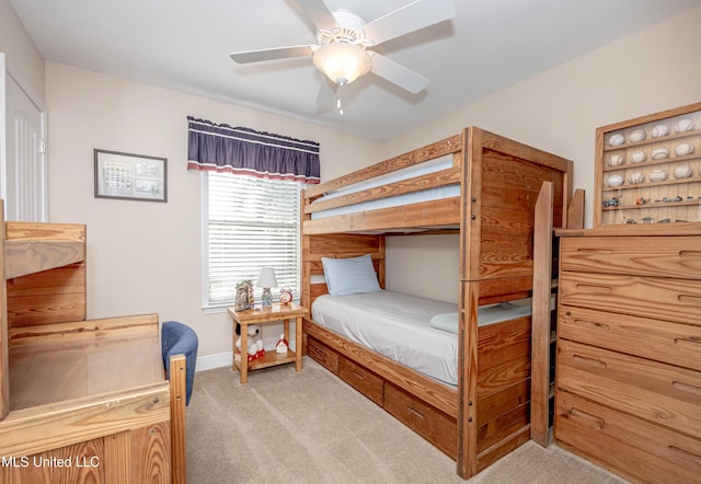 carpeted bedroom with baseboards and ceiling fan