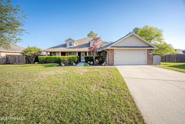 view of front facade featuring a front yard, an attached garage, fence, and concrete driveway
