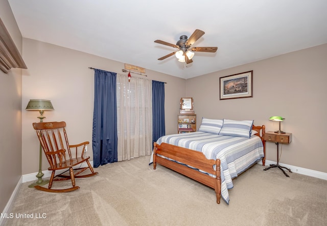 bedroom featuring carpet flooring, baseboards, and a ceiling fan