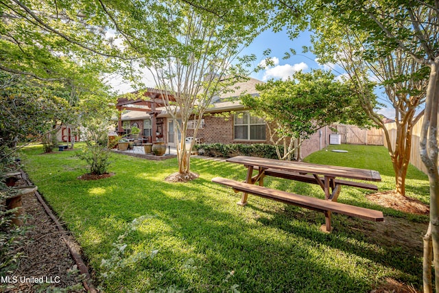 view of yard with a patio area and a fenced backyard