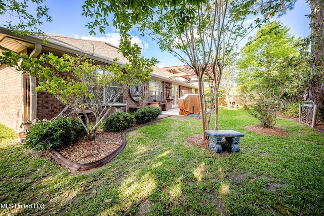 view of yard featuring a patio and fence