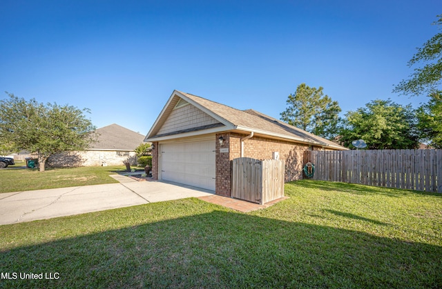 view of side of property with an outbuilding, a lawn, fence, brick siding, and a shingled roof