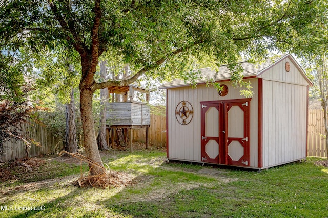 view of shed with a fenced backyard