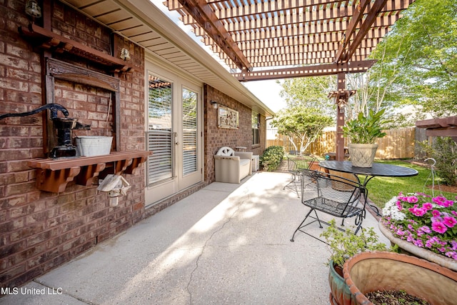 view of patio featuring fence and a pergola