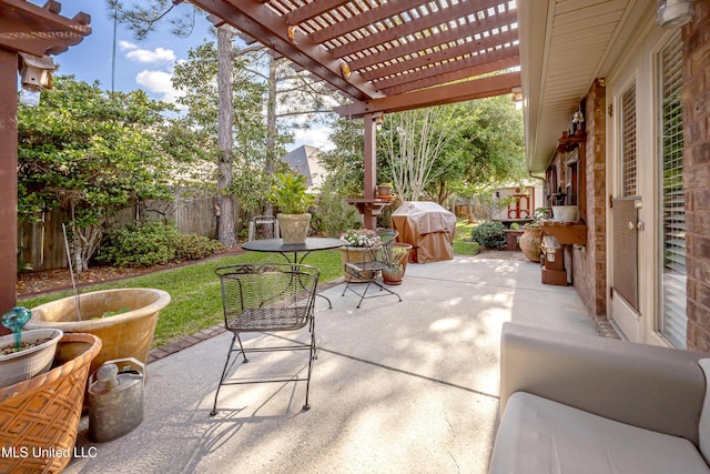view of patio / terrace with a fenced backyard, a grill, and a pergola