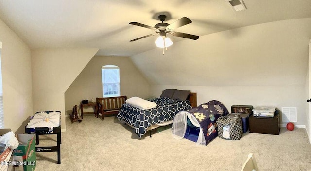 bedroom featuring a ceiling fan, carpet, visible vents, and vaulted ceiling