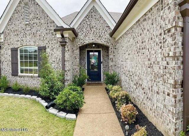 property entrance with brick siding