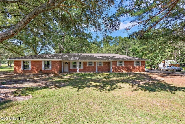 ranch-style home with a front yard