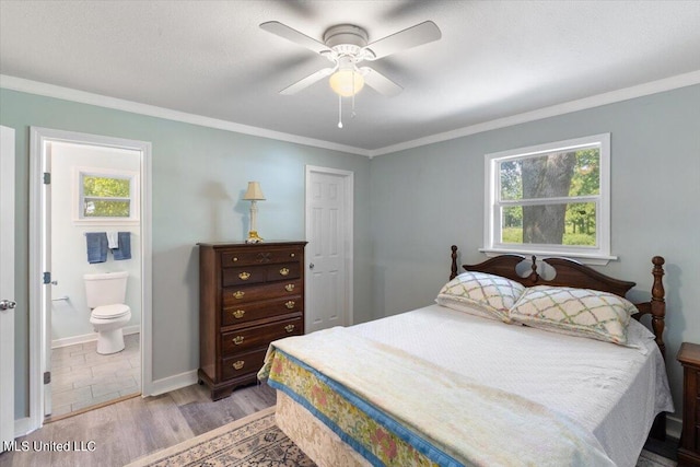 bedroom with crown molding, light hardwood / wood-style flooring, multiple windows, and ceiling fan