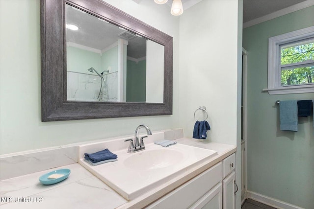 bathroom with vanity, walk in shower, and ornamental molding