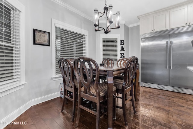 dining area with a chandelier, dark wood-type flooring, ornamental molding, and baseboards