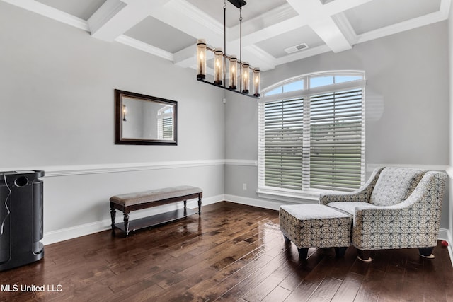 sitting room featuring coffered ceiling, a chandelier, hardwood / wood-style flooring, beam ceiling, and ornamental molding