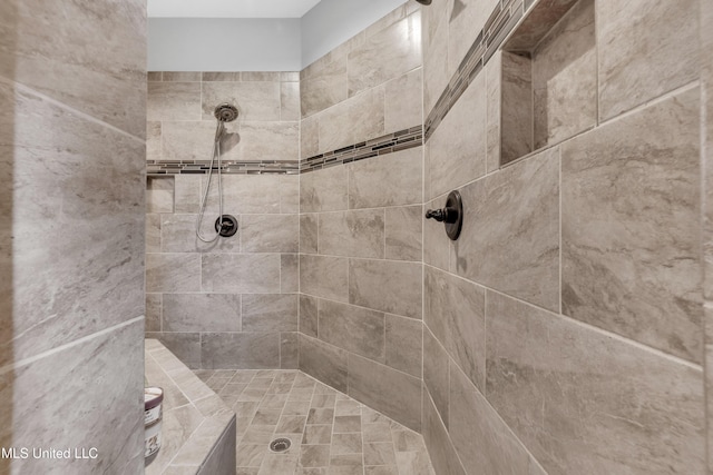 full bathroom with a tile shower