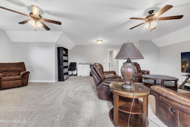living room with a ceiling fan, lofted ceiling, a desk, light carpet, and baseboards