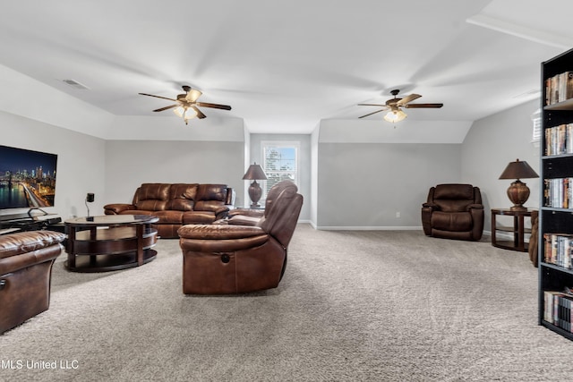 living room with a ceiling fan, carpet flooring, lofted ceiling, and baseboards