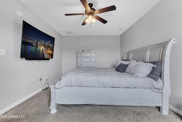 carpeted bedroom featuring baseboards and a ceiling fan