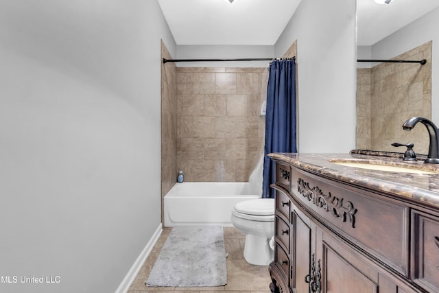 bathroom with toilet, vanity, tile patterned floors, shower / tub combo, and baseboards