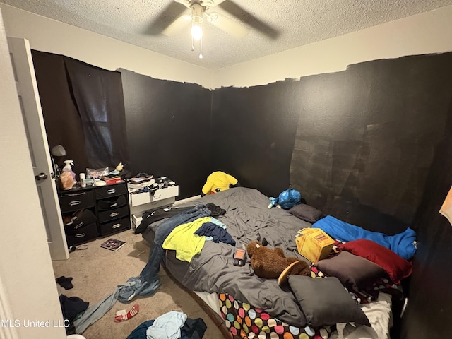 bedroom featuring carpet, a textured ceiling, and ceiling fan