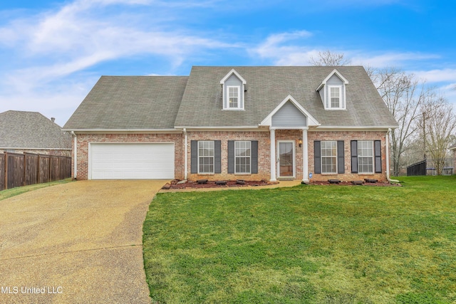 cape cod home with an attached garage, brick siding, fence, driveway, and a front lawn