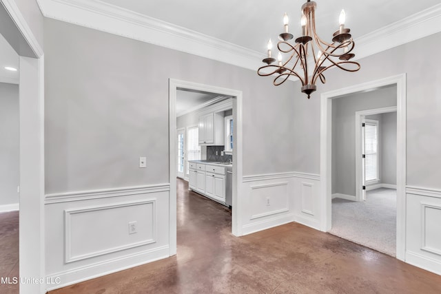 unfurnished dining area with concrete flooring, crown molding, and sink