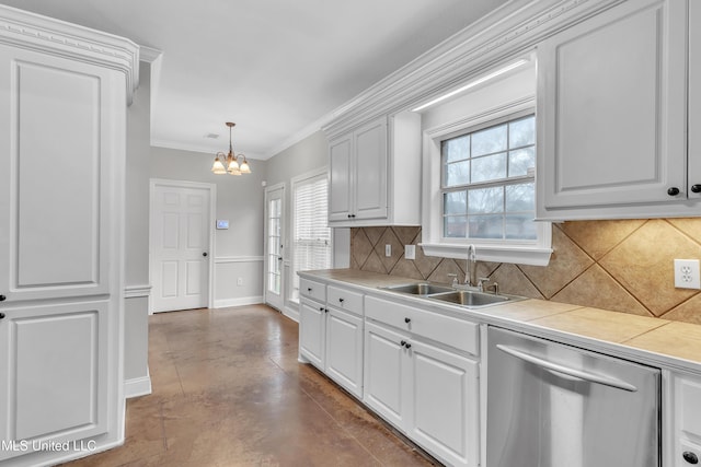 kitchen featuring decorative light fixtures, white cabinetry, dishwasher, sink, and tile counters