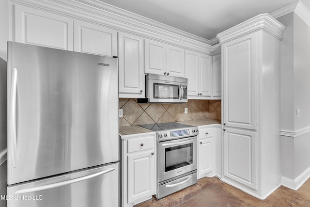 kitchen with white cabinetry, appliances with stainless steel finishes, and decorative backsplash