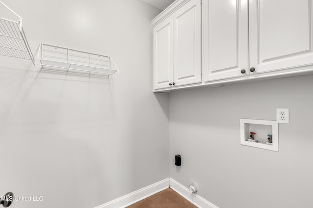 laundry area featuring hookup for a washing machine, cabinets, and hookup for an electric dryer