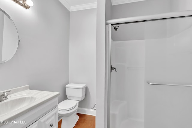 bathroom featuring toilet, hardwood / wood-style flooring, vanity, walk in shower, and crown molding