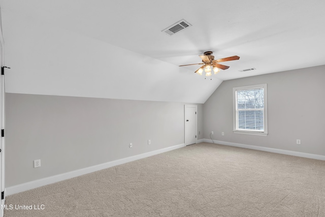 additional living space featuring vaulted ceiling, ceiling fan, and carpet floors