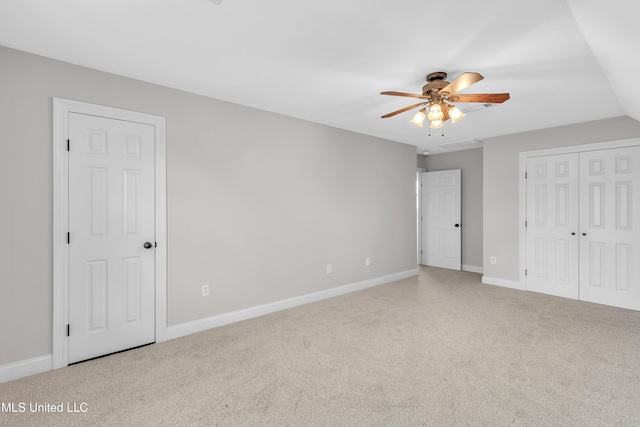 unfurnished bedroom with carpet floors and ceiling fan