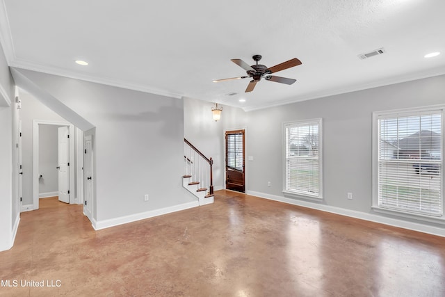 spare room featuring crown molding and ceiling fan