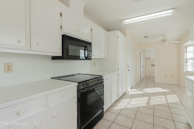 kitchen featuring white cabinetry, light tile patterned floors, black appliances, and ceiling fan