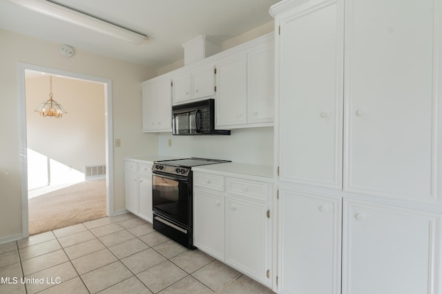 kitchen featuring light colored carpet, black appliances, decorative light fixtures, an inviting chandelier, and white cabinets