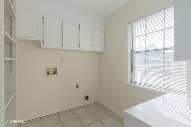 laundry room with cabinets, hookup for a washing machine, light tile patterned floors, and electric dryer hookup