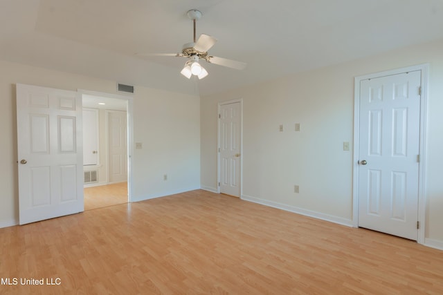 unfurnished bedroom with ceiling fan and light hardwood / wood-style flooring