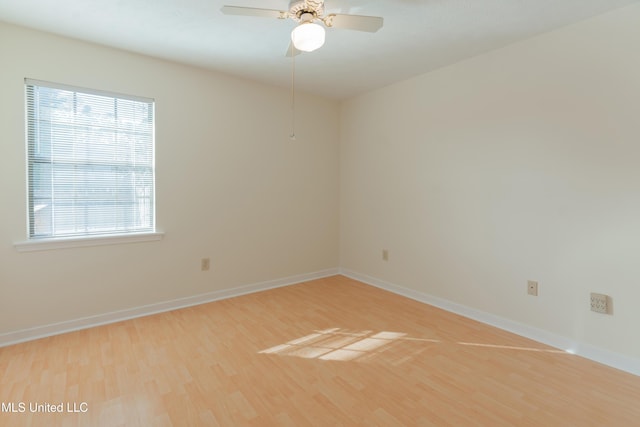 unfurnished room with hardwood / wood-style floors and ceiling fan