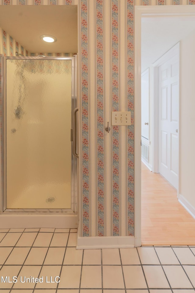 bathroom featuring tile patterned floors and walk in shower