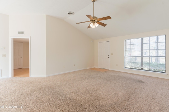 unfurnished room featuring ceiling fan, light carpet, and vaulted ceiling