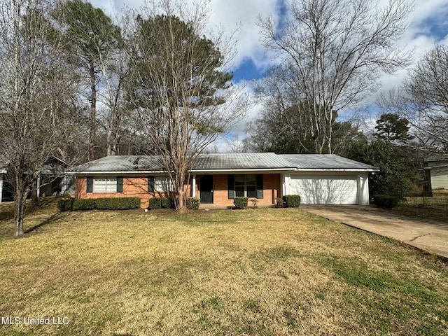 ranch-style house with a garage and a front yard