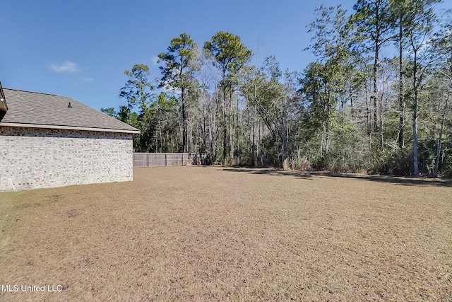 view of yard with fence