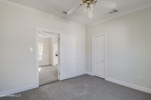 unfurnished room featuring ceiling fan, carpet floors, and ornamental molding