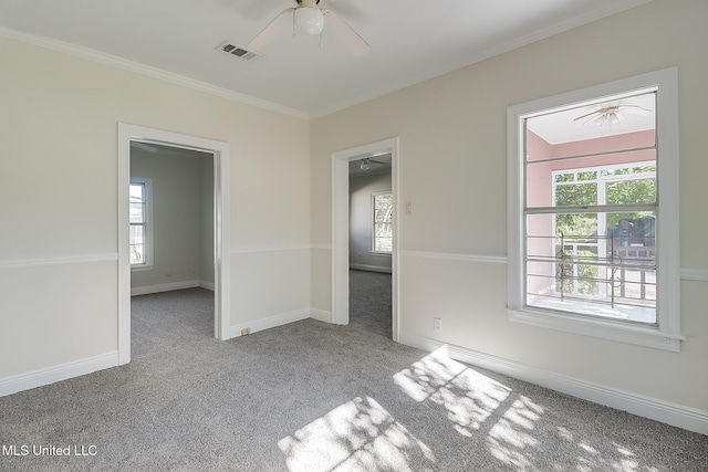 unfurnished room featuring a healthy amount of sunlight and light colored carpet